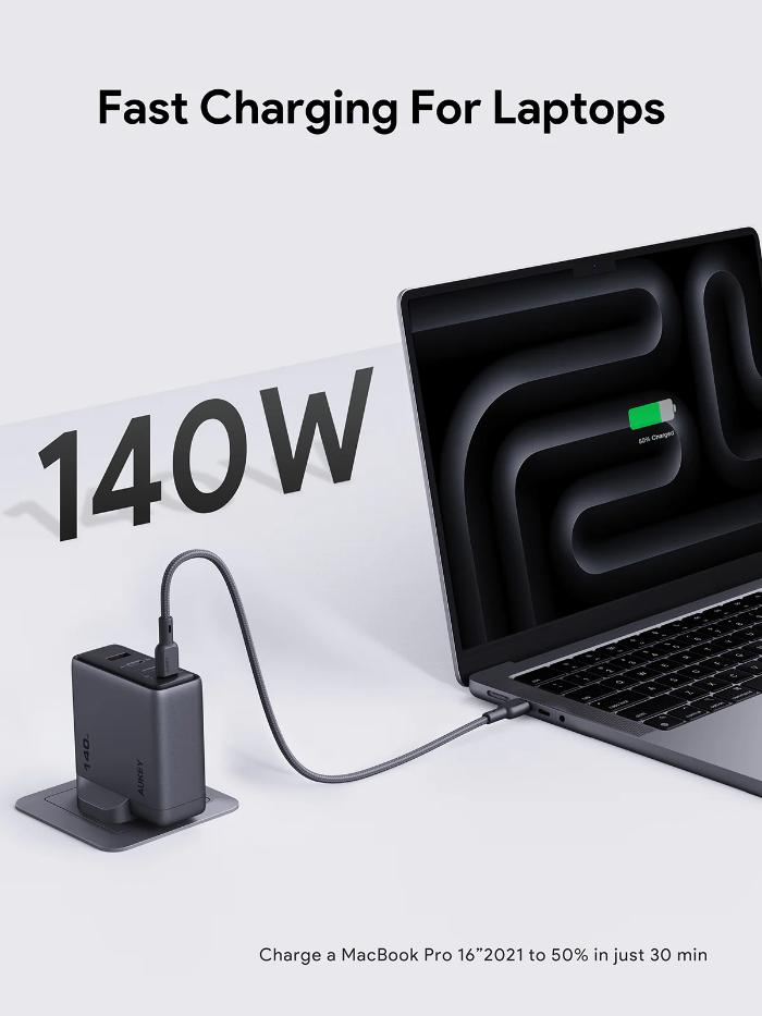 Laptop being charged with a Gray Aukey PA-C6 Comet Mix 4 140W PD Wall Charger with GaN Technology on a white background