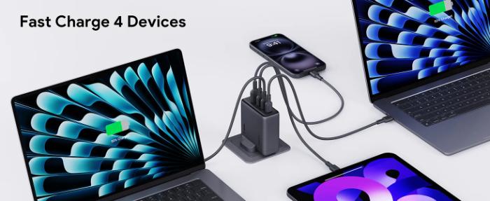 Multiple devices being charged by a Gray Aukey PA-C6 Comet Mix 4 140W PD Wall Charger with GaN Technology on a white background