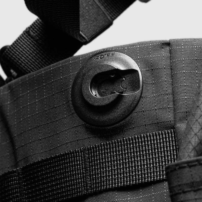Close-up of a Black Bitplay Black Series Sacoche 2L Crossbody Bag/Chest Bag with a buckle on a light gray background