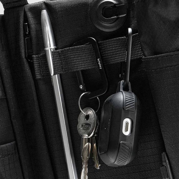 Close-up of a Black Bitplay Black Series Sacoche 2L Crossbody Bag/Chest Bag with keys, pen, and carabiner attached.