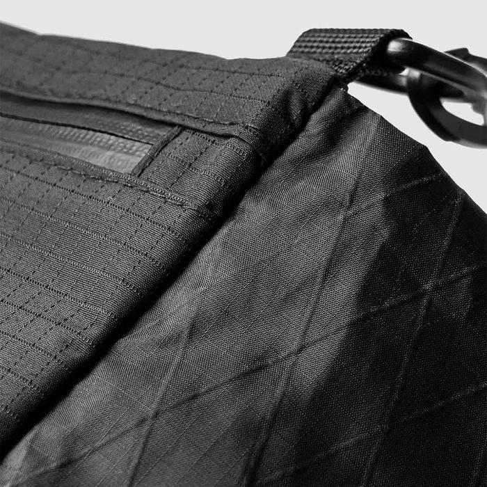 Close-up of a Black Bitplay Black Series Sacoche 2L Crossbody Bag/Chest Bag with textured surface and strap detail.