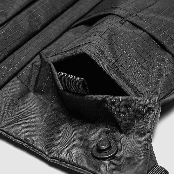 Close-up of a Black Bitplay Black Series Sacoche 2L Crossbody Bag/Chest Bag with a pocket detail.