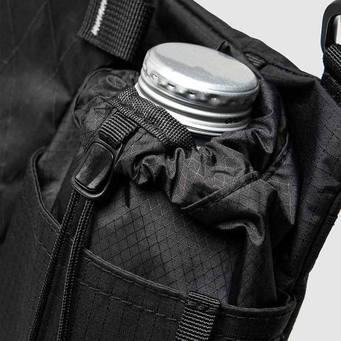 Black Bitplay Black Series Sacoche 2L Crossbody Bag/Chest Bag with a water bottle inside, showing the interior design.