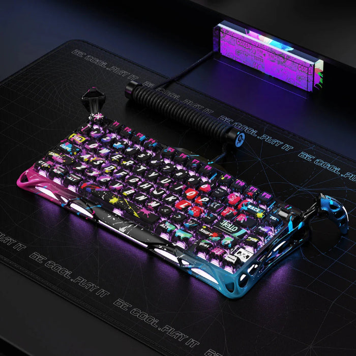 Neon Graffiti GravaStar Mercury V75 Pro 75% Hall Effect Magnetic Switch Gaming Keyboard on a dark surface with a glowing light in the background