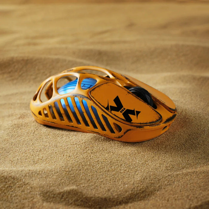 Yellow Gravastar Mercury X Wireless Gaming Mouse on a sandy background