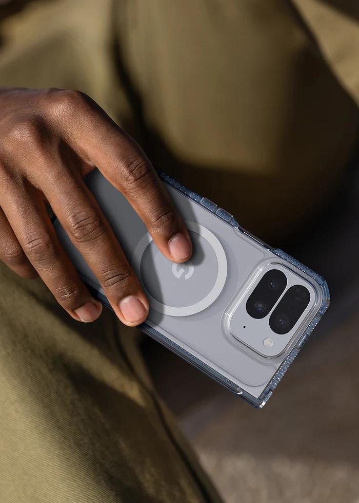 Person holding a phone with a Transparent ITSKINS Hybrid R Clear Hinge Magnetic Case for Google Pixel 10 Pro Fold (2025), wearing a green jacket.