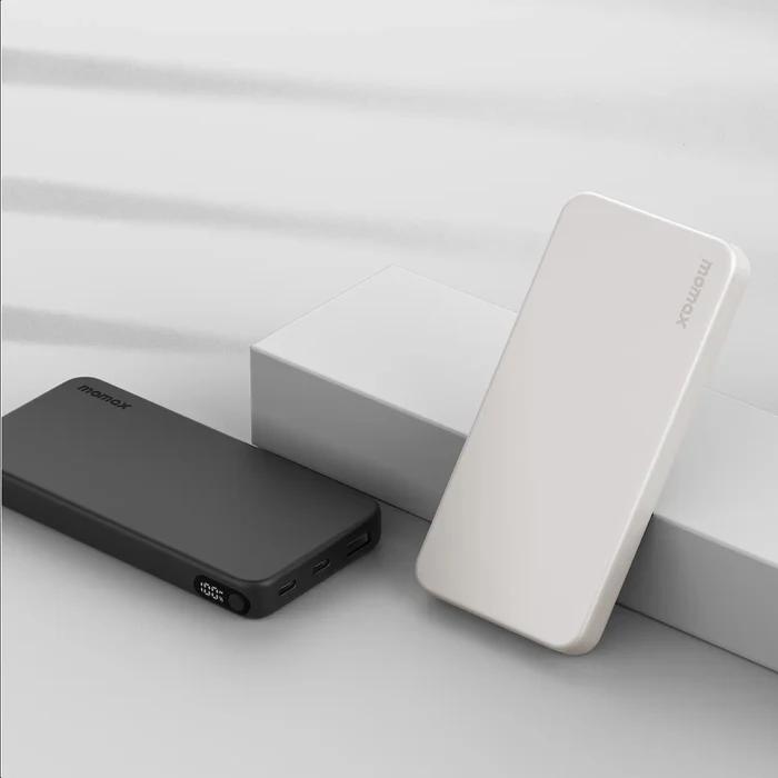 Black and White Momax IP155W 10000mAh 1-Power Vital Battery Pack on a light gray surface with a white background.